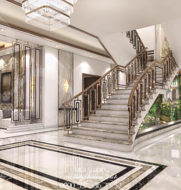 Luxurious entrance hall with a grand staircase.