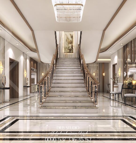 Luxurious entrance hall with a grand staircase.