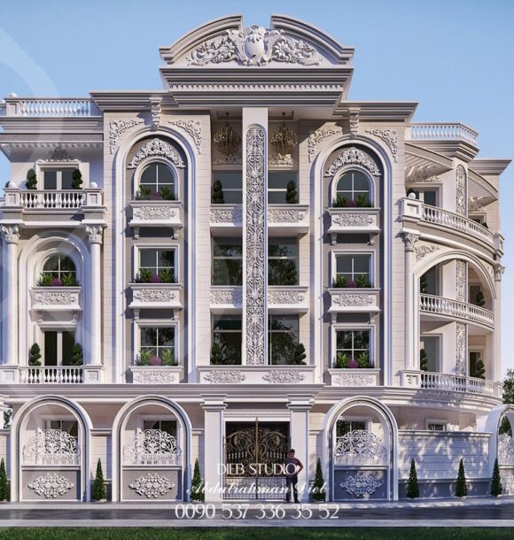 A classic, multi-story building with a symmetrical facade, featuring arched windows, ornate columns, and decorative balconies.